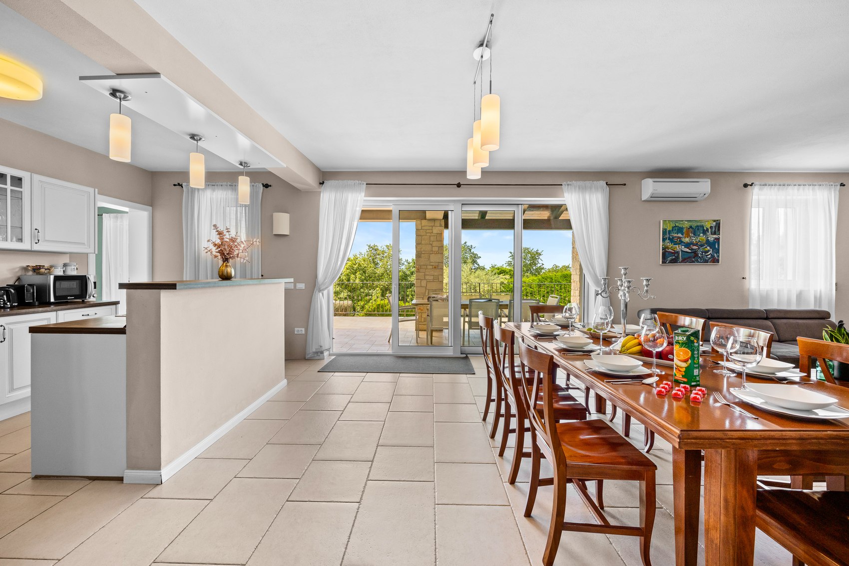 Open-plan living and dining space inside Villa Babudri